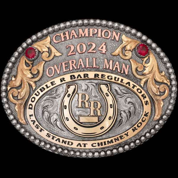 "Our Middleburg Belt Buckle is a true statement piece, blending elegance with rugged western charm. It's oval design features a beaded edge, 2 cubic zirconia stones, Jeweler's Bronze scrolls and Copper lettering. This Buckle is crafted on a matted, G